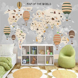 Kids world map mural in classroom setting with reading corner and educational displays