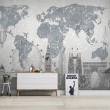 World Map Wall Mural featured in stylish living room setting with grey furniture