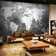 Black and white world map wallpaper creating a modern look in a minimalist office space