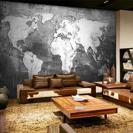Black and white world map wallpaper creating a modern look in a minimalist office space