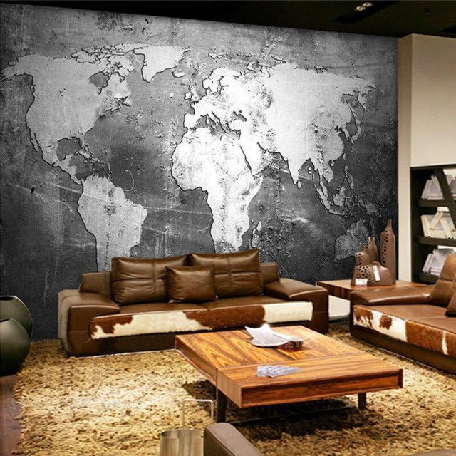 Black and white world map wallpaper creating a modern look in a minimalist office space