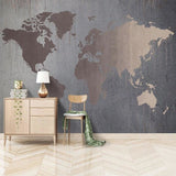 Modern World Map Wall Mural in study room with wooden shelves and bronze lighting