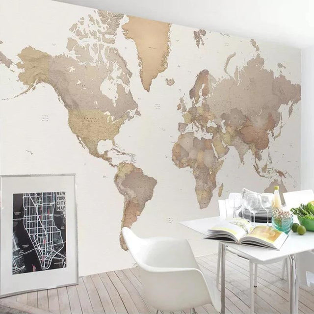 Modern World Map Wallpaper displayed in a bright home office, showing beige continents against white background