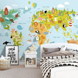 Kids world map wallpaper creating a fun atmosphere in a cozy nursery setting