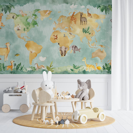World map wallpaper with safari animals brightening a modern nursery with mint green and gold tones